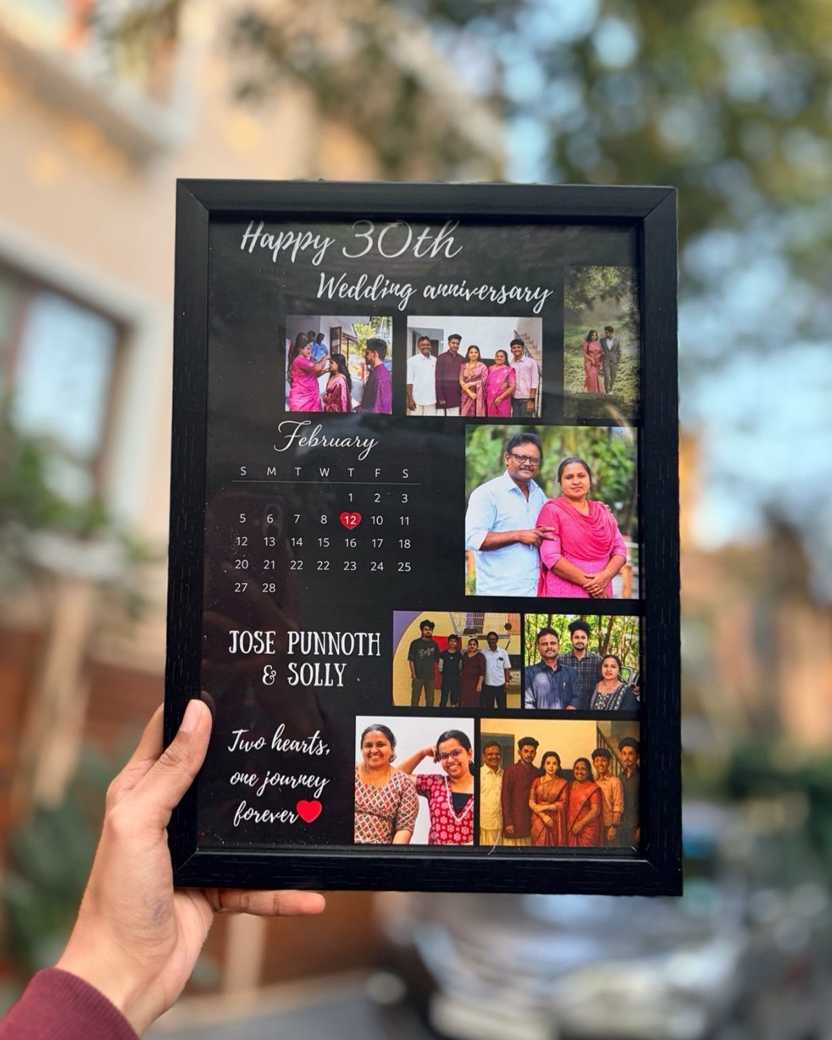 Black framed anniversary collage with family photos, a calendar, and celebratory text.